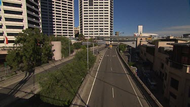 Sydney streetscape. Buildings. Imax theatre and Darling Harbour in background behind elevated road. (Sussex street?) (Western Distributor).
