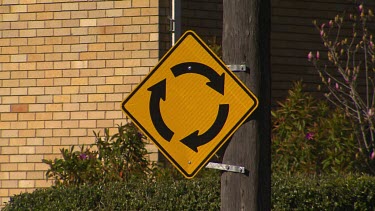 Medium shot street Sign roundabout (black and yellow).
