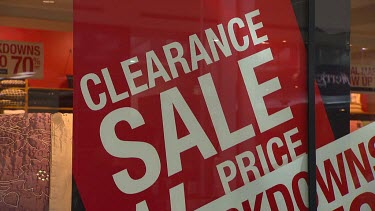 Shop store signage "Clearance sale half price markdowns".