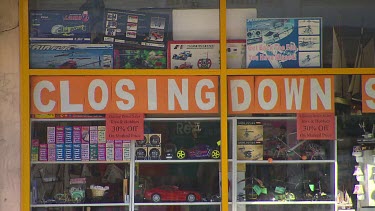 Shop with sign in window "Closing Down"