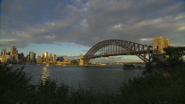 Sydney harbour with Harbour bridge and North Sydney, Millers Point, Kirribilli. Gentle soft light with clouds