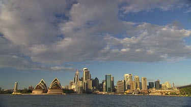 Sydney Harbour with Opera House and Circular Quay. City ferries pass in front of city