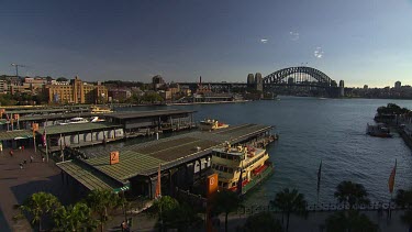 Time lapse Sydney Circular Quay, Harbour with Harbour Bridge. Museum of Contemporary Art in background and the Rocks.