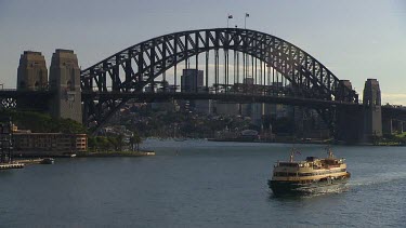 Sydney Harbour Bridge and Ferry, looking North to Milson's point and North Sydney