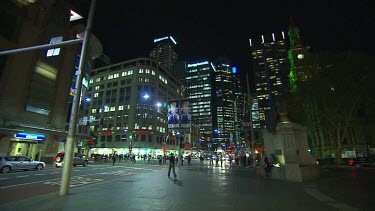Nightlife in the city, Sydney. Office workers and shoppers, pedestrians walking.