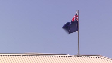 Australian Flag blue sky, corrugated iron roof