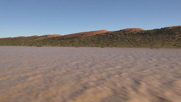 Tracking over flooded waters of Diamantina River, outback desert river in flood.