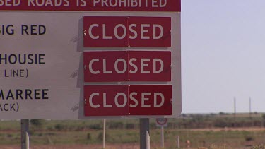 Road signs "Closed" (because of flooding in Simpson Desert Diamantina River)