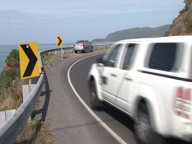 Various shots. Driving on Great Ocean Road. Road signs, windy road.