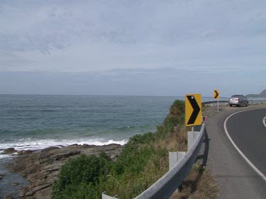 Various shots. Driving on Great Ocean Road. Road signs, windy road.