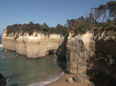 limestone cliffs showing erosion by waves, water. Sea Arch