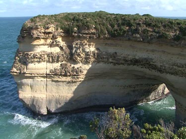 limestone cliffs showing erosion by waves, water. Sea Arch