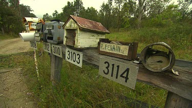 Long shot of row of post boxes in rural area, New South Wales, Australia