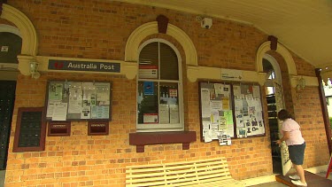 Victorian Post Office with woman entering.