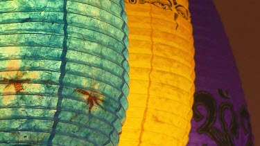 Chinese lanterns, turquoise blue, yellow and purple.