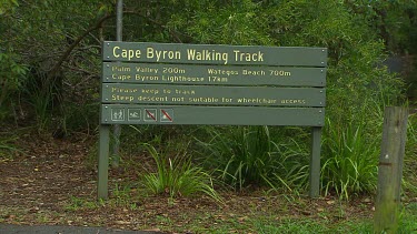 Cape Byron Walking Track sign with directions to Palm Valley, Wategos Beach and Cape Byron Lighthouse.