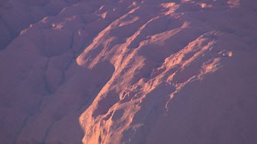 People climbing Uluru.  The traditional aboriginal landowners discourage tourists climbing their sacred rock but there are no rules making it illegal. They feel climbing the rock is disrespectful to t...