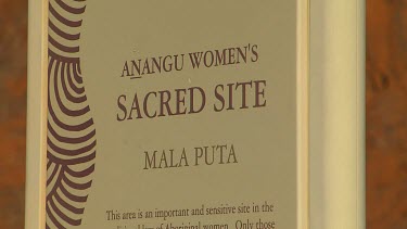 Sign Uluru Do not take photographs Anangu women's Sacred site Mala Puta. This area is an important and sensitive site