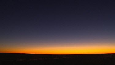 Uluru sunset, Very wide shot. Super Wide angle lens. Sunset sky red orange yellow blue, black