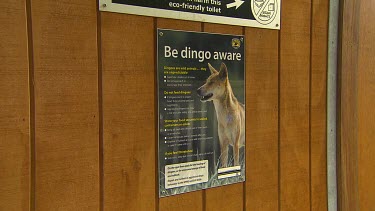 Zoom in on dingo sign. Sign reads  Be Dingo aware, dingoes are wild animals; do not feed dingoes;