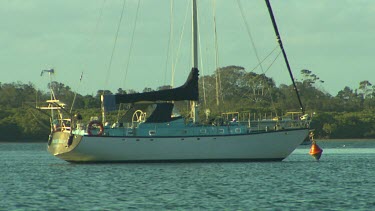 Anchored yacht with sails down