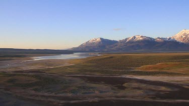 Aerial along west shore of Crowley Lake at surise
