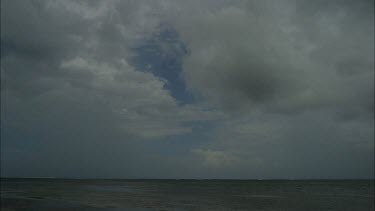 Clouds developing into rain storm over ocean