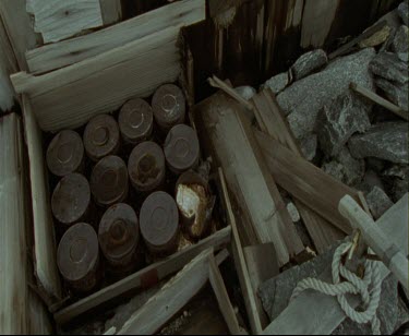 Detail of Mawson's Huts. Cape Denison Commonwealth Bay. Australian Antarctic Territory. Wood, rocks, rope, cans. Locked off shot.