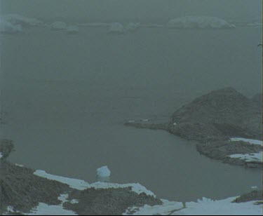 Antarctic coast. Cape Denison Commonwelath Bay. Locked Off shot, looking towards ocean. See Mawsons Huts in distance