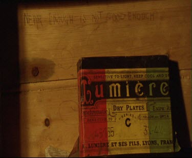 Frank Hurley's darkroom Mawson's Huts with motto scratched into wood Near Enough is not Good enough. Lumiere plates