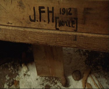 Details of interior of Mawson' s Hut. Initials carved in wood of members of expedition and date 1912. JFH Hoyle.