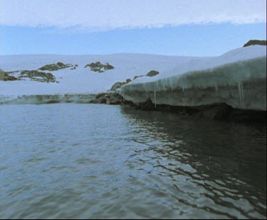 Bay with overhanging ice sheet or ice shelf
