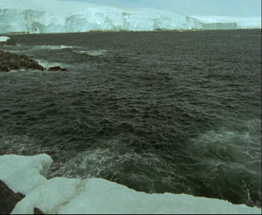 Bay with overhanging ice sheet or ice shelf