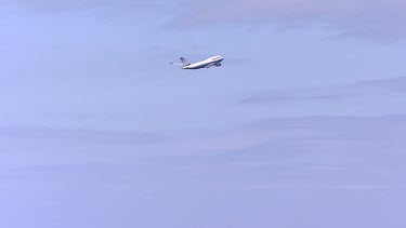 United Airlines plane flying in sky. Wide Shot