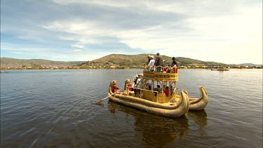 A hand made reed boat full of tourists on Lake Titicaca