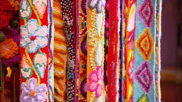 Close up shot of some brightly coloured traditional Peruvian cloth
