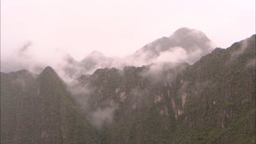 Misty mountains surrounding Machu Piccu