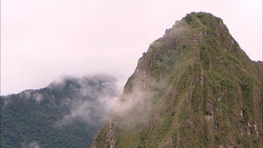 Huayna Picchu with a little cloud cover and tourists climbing up