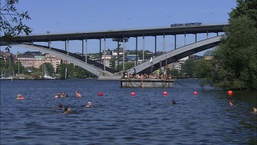 People swimming and resting in the centre of Stockholm, Sweden