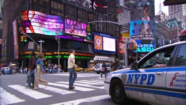 NYPD, New York Police Department car. Pedestrian crossing, zebra crossing. Times Square Broadway, New York.
