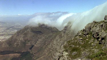 "Tablecloth" of cloud moving over top of Table Mountain