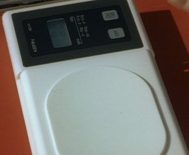 Scientists measuring weighing week old puggle