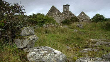 Aillenacally, Ireland's oldest village dating back to 500BC. Connemara, County Galway west coast of Ireland. Stone ruins of house with chimney.  Window frames frame view of outside.