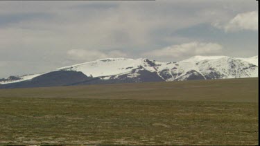 Wide shot Establishing shot. Pan of Chang Tang Plateau, Tibet. The world's highest nature reserve. Often called the "roof of the world".