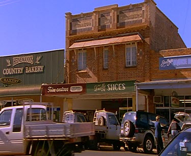 Small outback town. Hotel Verandah. Street shops main street.