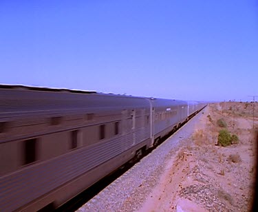 Train and track outback disappearing into distance