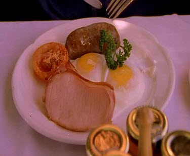 Traditional English Australian Breakfast sausage eggs and bacon