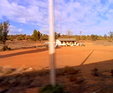 Past small outback station in middle of the desert