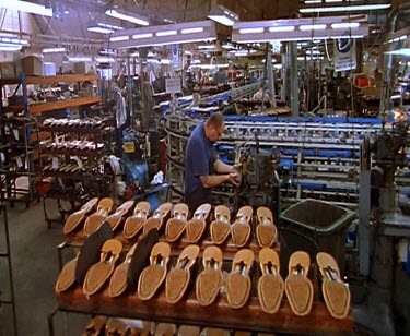 R.M. Williams boot makers cutting leather