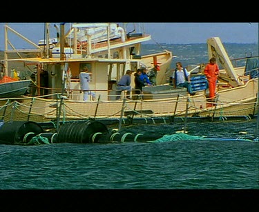 Boat alongside Blue fin tuna nets.